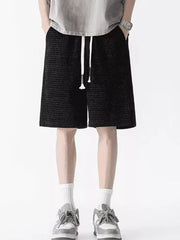 Men's black waffle-knit casual shorts with drawstring and pockets