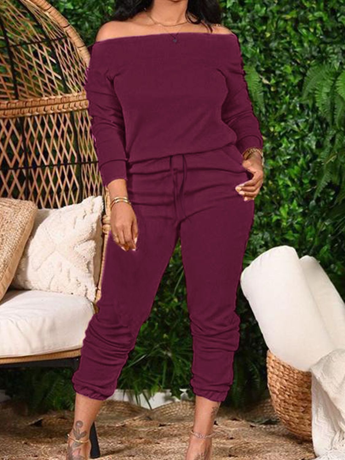 Burgundy off-shoulder lounge set with ruched hem pants and drawstring waist.
