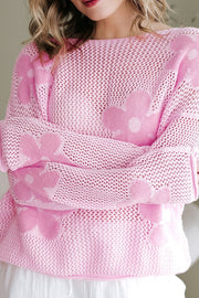Openwork blush pink sweater with floral intarsia pattern and crew neck.