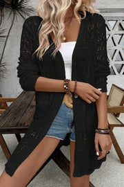 Black openwork crochet duster cardigan with long sleeves and a breezy, casual fit.