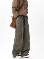 Men's green drawstring cargo pants with multiple pockets and relaxed fit