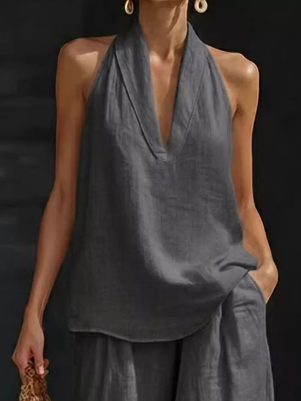 Gray halter neck top and wide-leg pants set with V-neckline and pockets