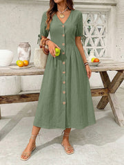 Sage button-down midi dress with V-neck, short tie sleeves, and wooden buttons.