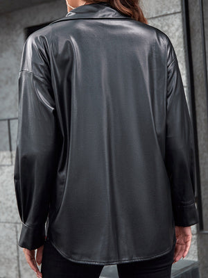 Black faux leather shacket with button-down collar and long sleeves.