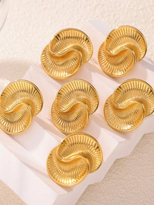 Gold vermeil shell stud earrings with sculpted ribbed detail.