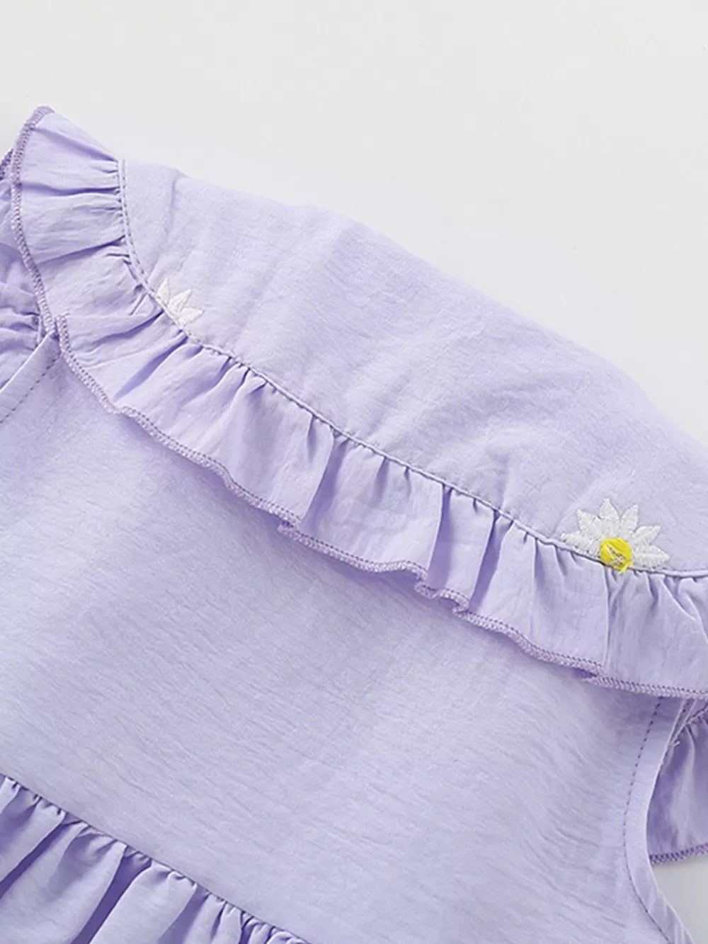 Lavender cotton dress with Peter Pan collar, ruffles, and daisy embroidery.