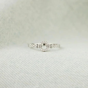 Silver pavé oval chain link ring with baguette accents