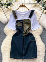 White knotted tee and distressed denim overall dress ensemble with patchwork and embroidery detail.