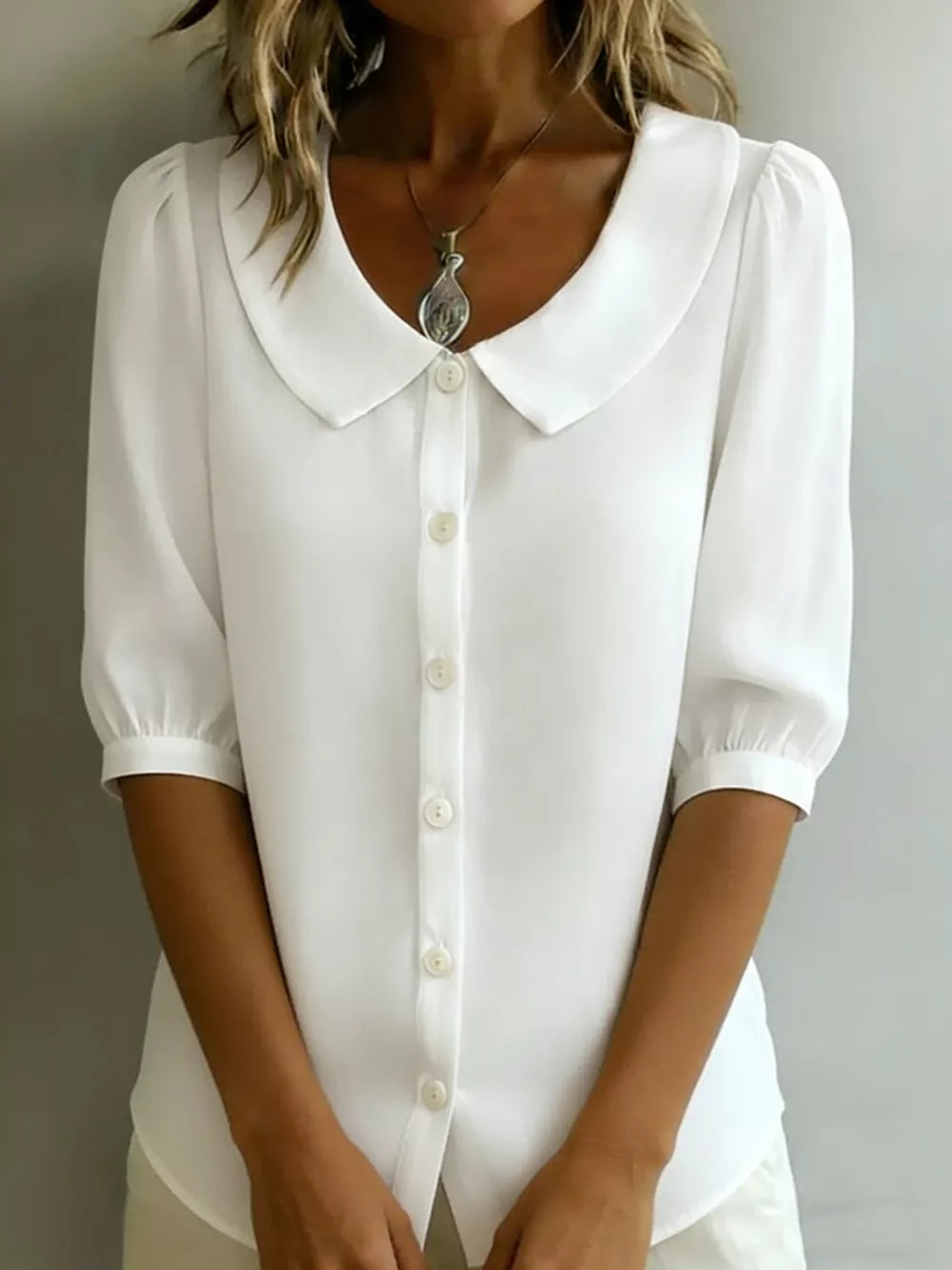 White puff sleeve shirt with Peter Pan collar and button-down front