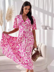 Vibrant hot pink and white abstract pattern midi dress with flutter sleeves and a v-neck.