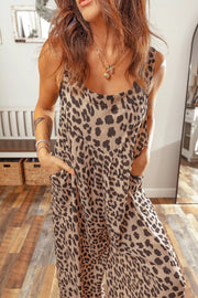 Chic leopard print wide-leg jumpsuit with square neckline and pockets.