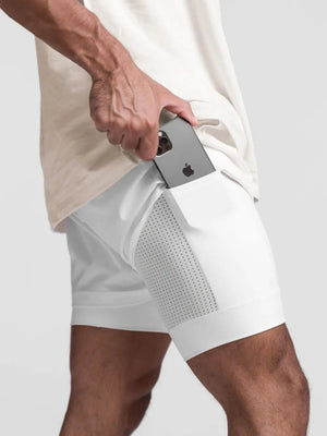 White layered performance shorts with perforated side panels and phone pocket detail.