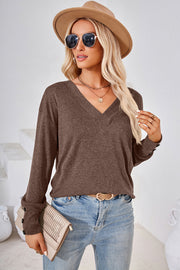 Mocha slouch v-neck top with button cuffs and long sleeves.