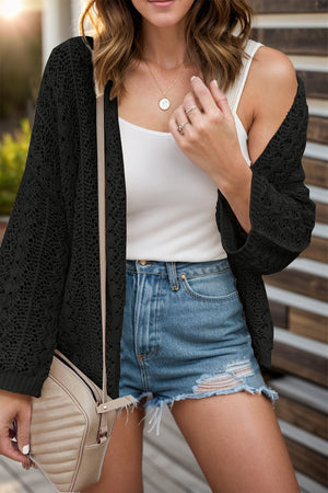 Black open-knit crochet sleeve cardigan with a relaxed fit, styled with a white tank and denim shorts.