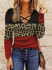 Crisscross leopard block top in deep red, black, and animal print with long sleeves.