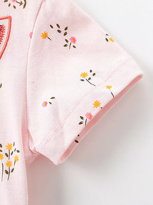 Pink cotton toddler dress with a delicate floral print and embroidered detail.