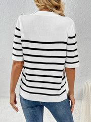 White knit top with black stripes and button shoulder detail