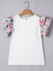 White geometric knit top with floral ruffled sleeves