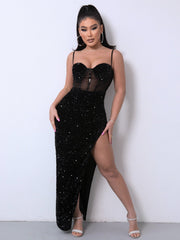 Black sequin corset maxi dress with sheer panel and high slit.
