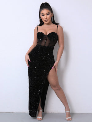 Black sequin corset maxi dress with sheer panel and high slit.