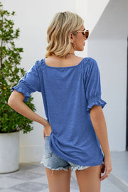 Cobalt blue gathered square neck puff sleeve top with ruffled cuffs.
