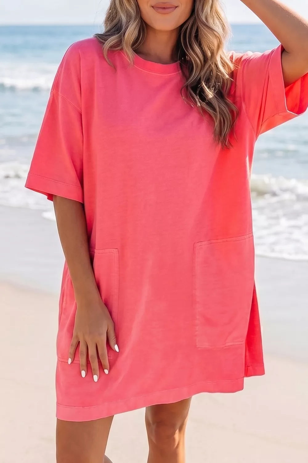 Coral cotton blend t-shirt mini dress with crew neck, drop shoulders and front pockets.