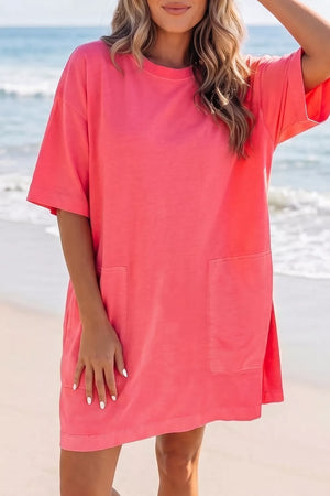 Coral cotton blend t-shirt mini dress with crew neck, drop shoulders and front pockets.