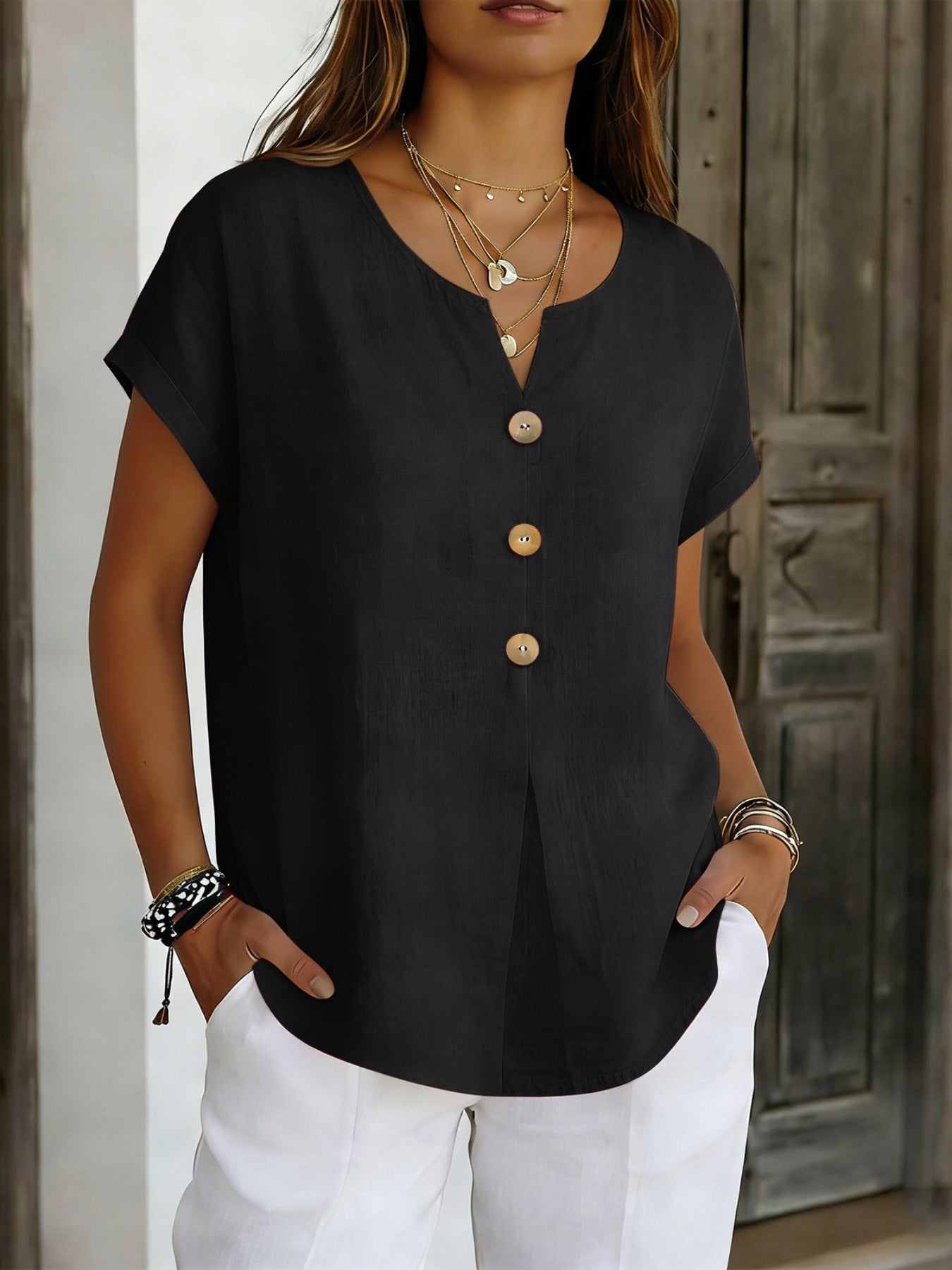 Black buttoned short sleeve blouse with V-neck and wooden buttons