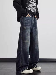 Distressed wide leg men's dark wash denim jeans with a relaxed fit.