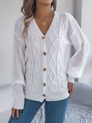 White cable knit balloon sleeve cardigan with button front and v-neck.