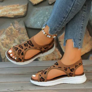 Leopard print open-toe platform sandals with a comfortable elastic strap and white sole.