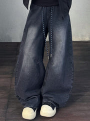 Men's dark grey vintage wash baggy cotton jeans with drawstring and a relaxed fit.