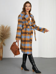 Belted bouclé overcoat in blue and orange plaid, with a tie waist.