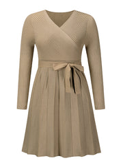Khaki ribbed knit wrap dress with long sleeves, tie waist, and pleated skirt.