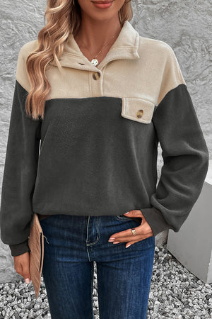 Colorblock fleece button-up pullover in dark gray and beige with a chest pocket.