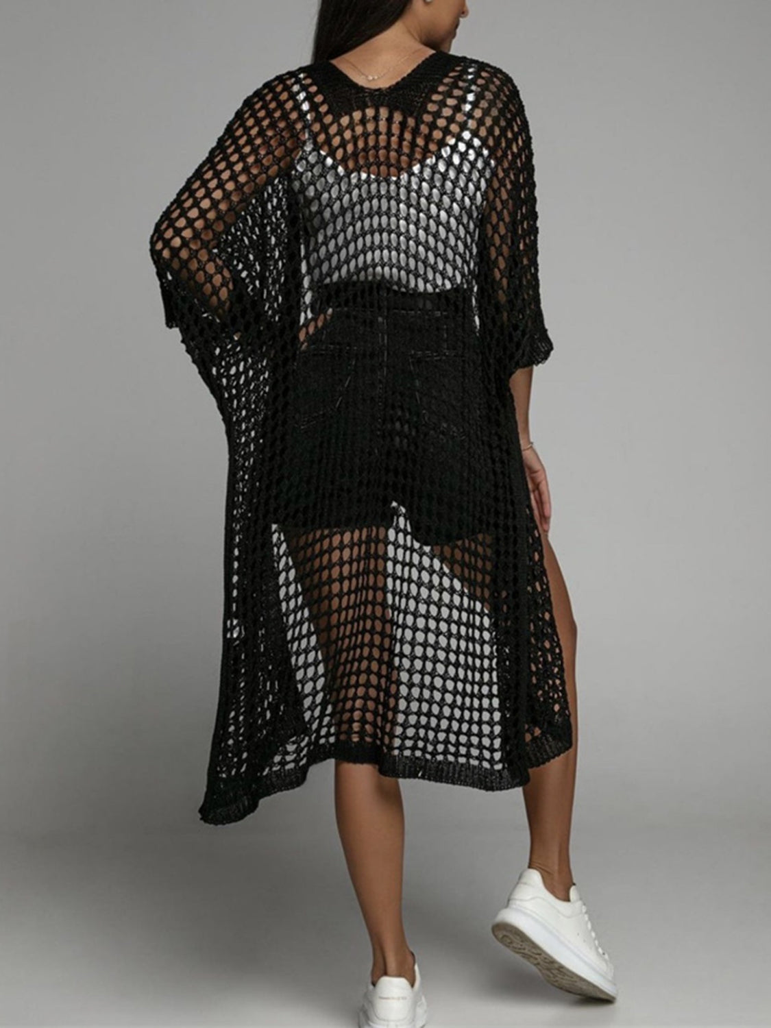 Black open-knit duster cardigan with V-neck and short sleeves, acrylic material.