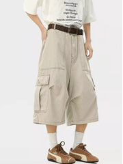 Relaxed fit khaki cargo sweatpants with multiple pockets and a cropped length.