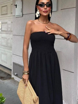 Black strapless smocked bodice relaxed maxi dress with a flowing skirt.