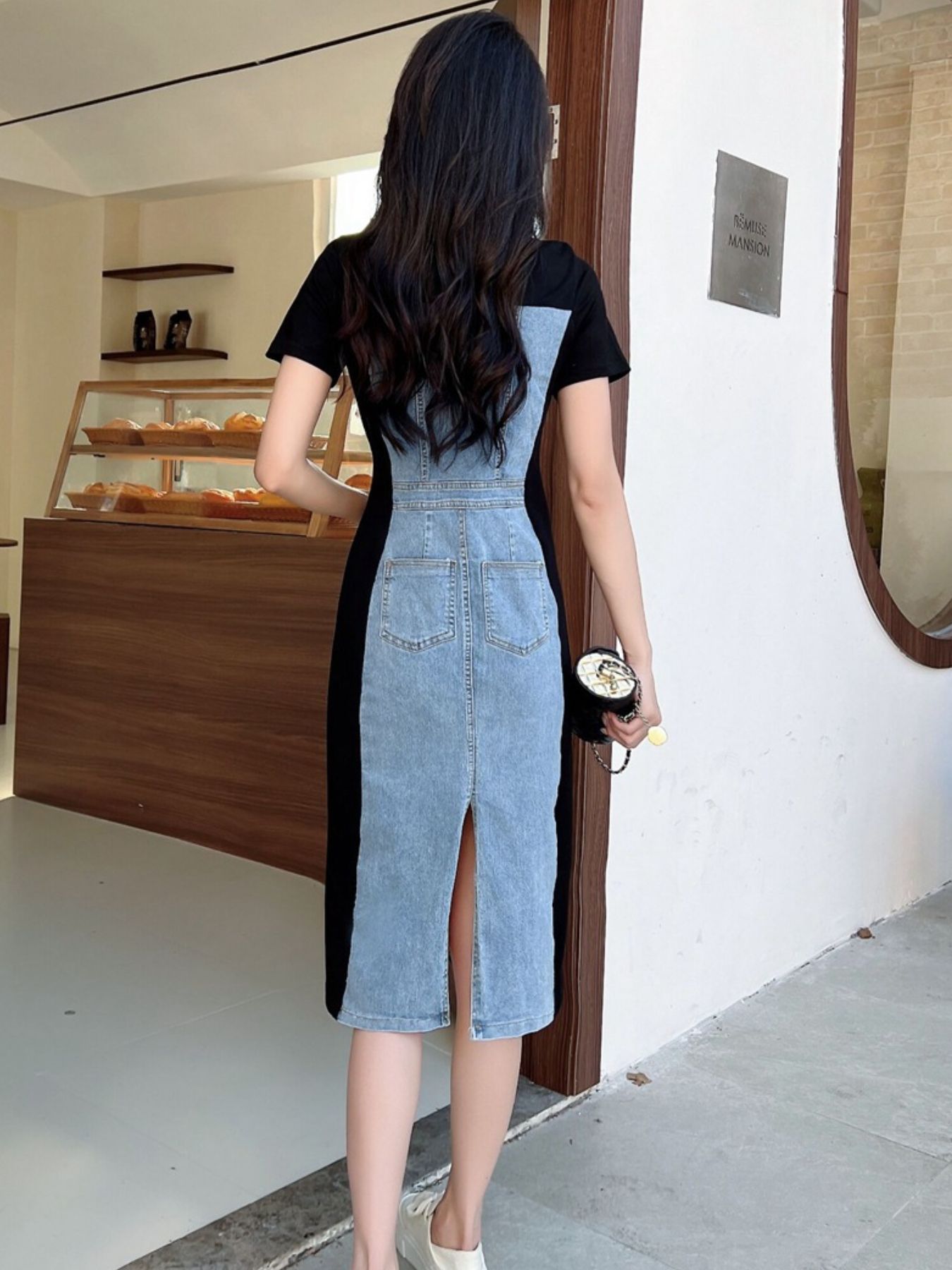 Denim patchwork short-sleeve dress in sky blue and dark blue with button details and a slit hem.