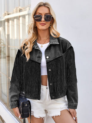 Black denim trucker jacket with fringe trim and a boxy cut.