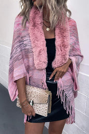 Textured knit cape in Dusty Pink with faux fur collar and fringe detail