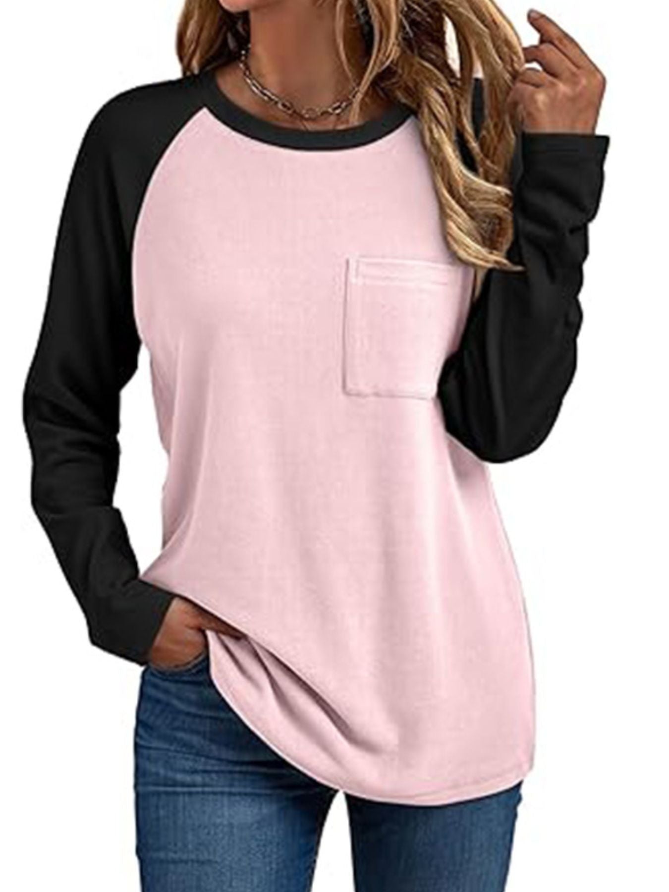 Pocketed round neck long sleeve t-shirt in blush pink with black raglan sleeves.