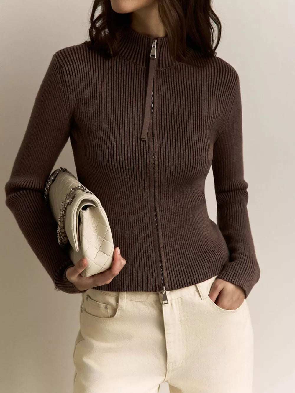 Chocolate ribbed zip-up cardigan with mock neck and long sleeves.