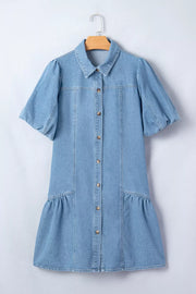 Light blue denim dress with puff sleeves, button front, and ruffled hem.