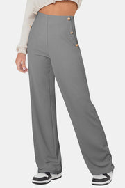 Gray wide leg trousers with gold button detail on the side.