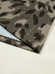 Sleek mock neck slim tee in camouflage print with double-stitched hem detail.