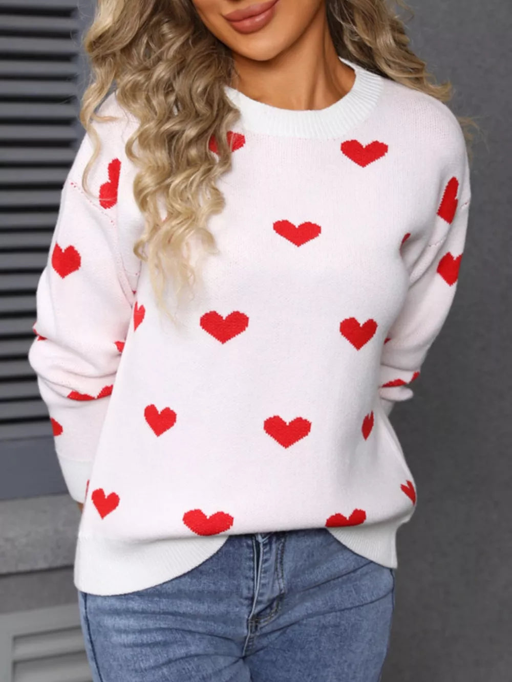 White knit sweater with red heart pattern, crew neck, long sleeves, casual fit
