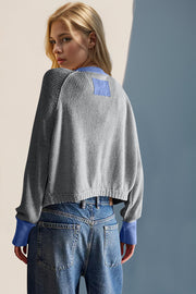Dark Gray raglan sleeve cardigan with contrast Indigo trim and patch detail.