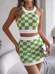 Green and white checkerboard knit halter crop top and mini skirt set.