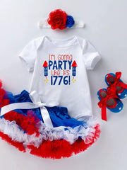 White baby onesie with "I'm Gonna Party Like It's 1776!" text, red & blue tutu, headband, and star shoes.